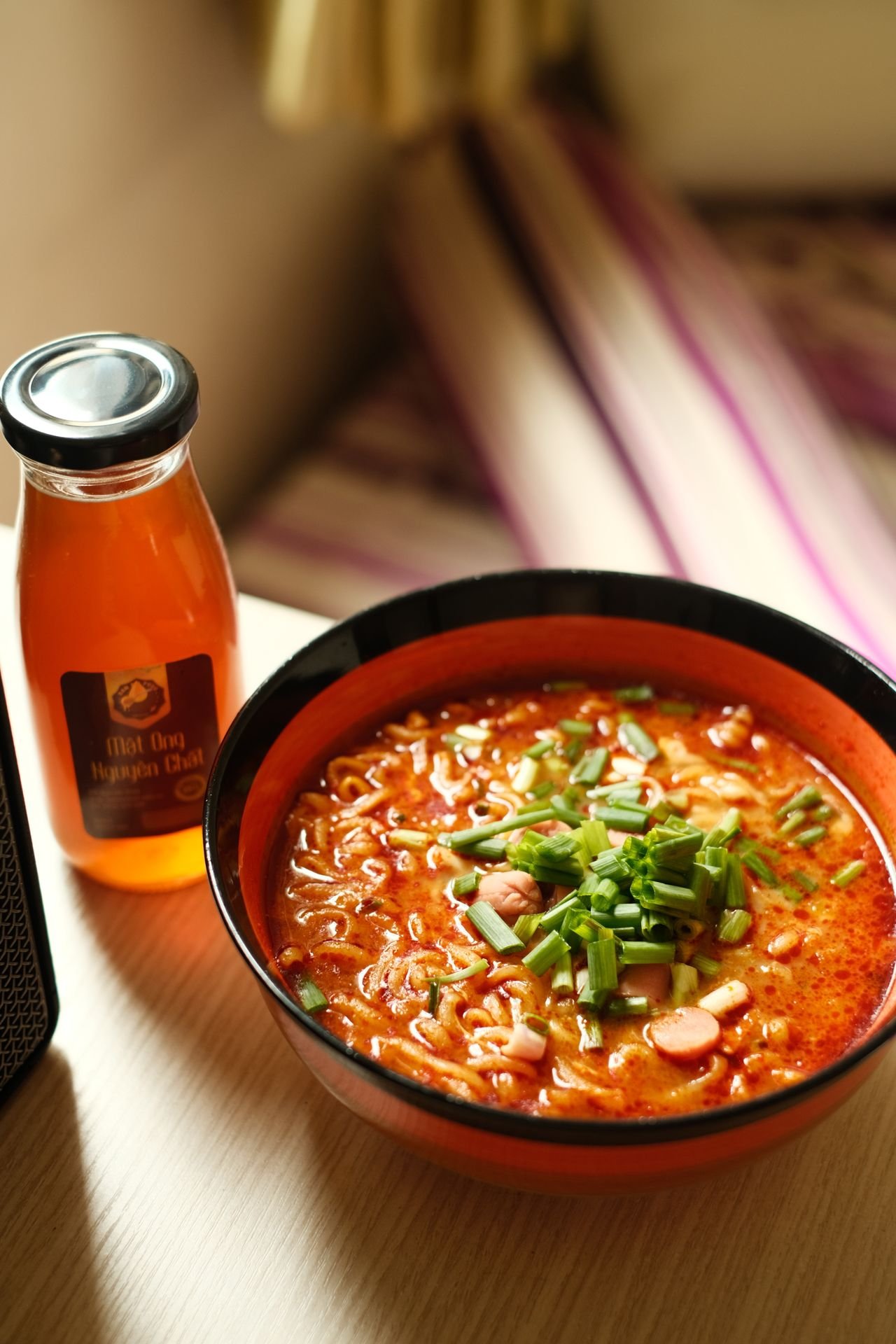 Steaming bowl of Japanese clear vegetable soup with finely diced carrots, sweet potatoes, and tomatoes in a ceramic bowl